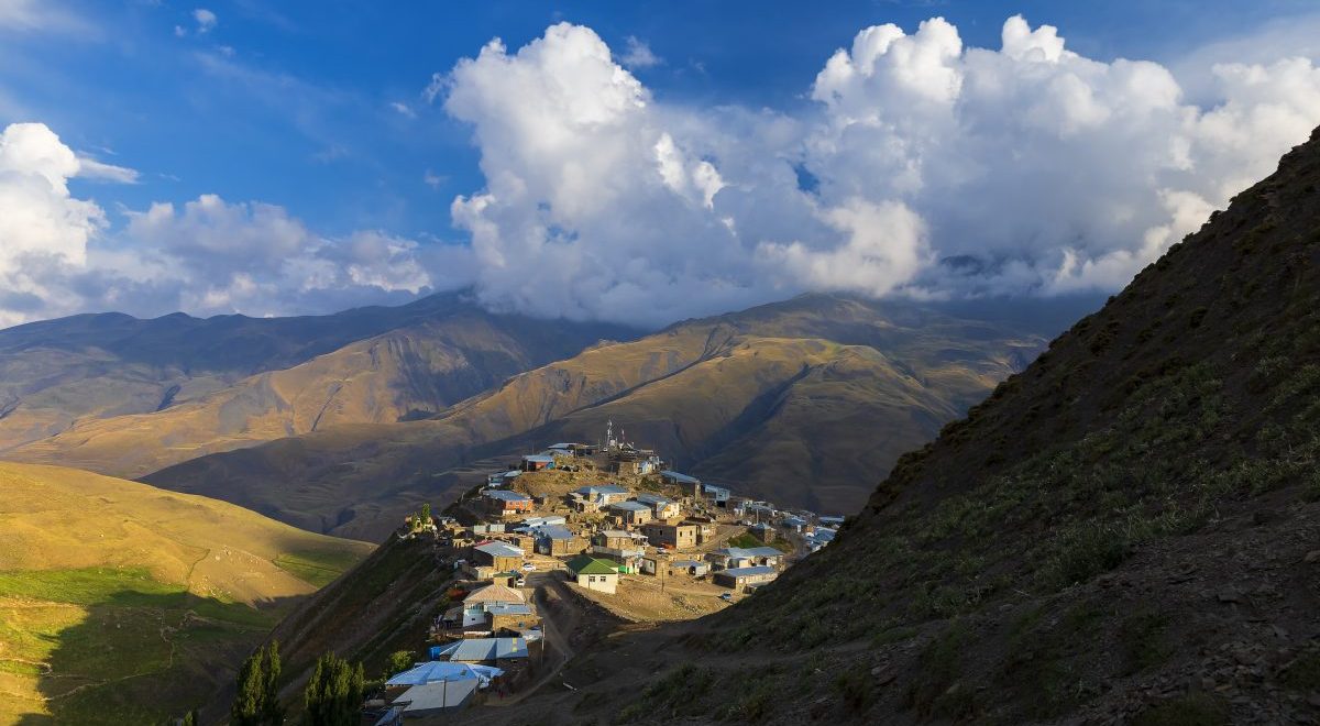 The alpine village of Khinalig at sunset against the backdrop of beautiful clouds