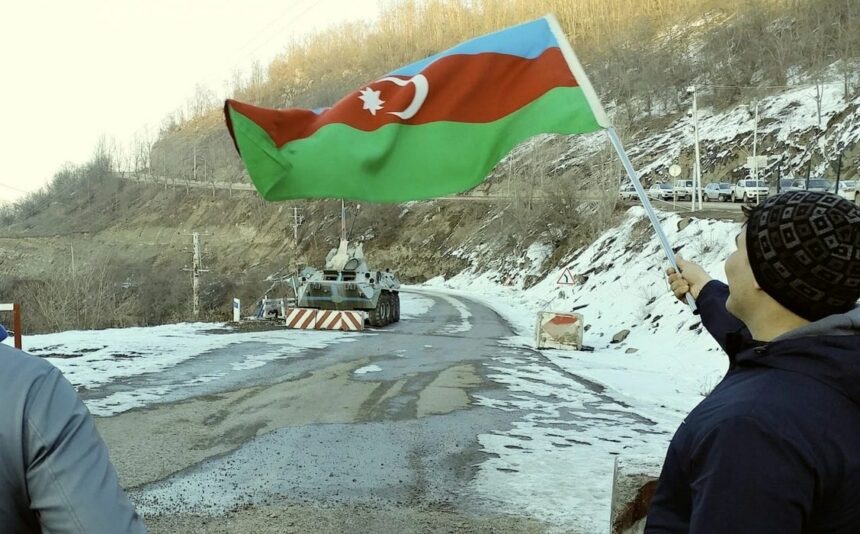 Protesters waving to Russian peacekeepers scaled e1675033042950