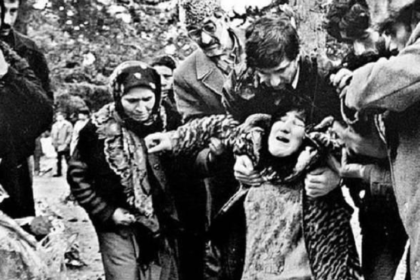 A traumatised woman collapses following the 1992 Khojaly massacre