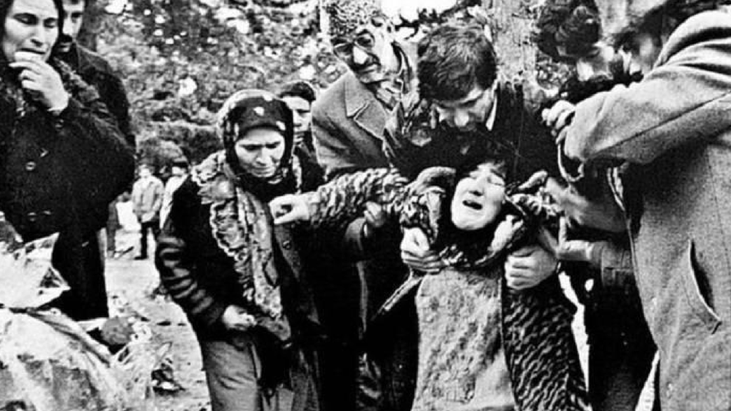 A traumatised woman collapses following the 1992 Khojaly massacre