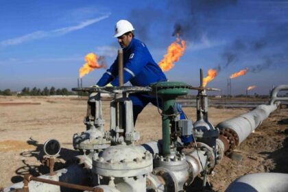 A Worker Controlling A Valve In An Oil Field In Iraq. Photo Ina 850x560