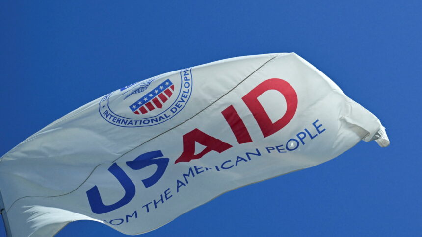 The Usaid Flag Flies Outside The Usaid Building In Washington