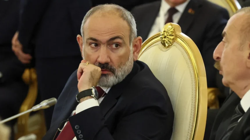 Armenian pm nikol pashinyan listens to azerbaijani president ilham aliyev oct 2024 afp pool.jpg