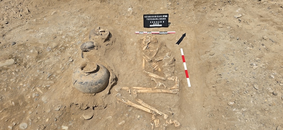 Skeletal remains of the burial with associated artifacts